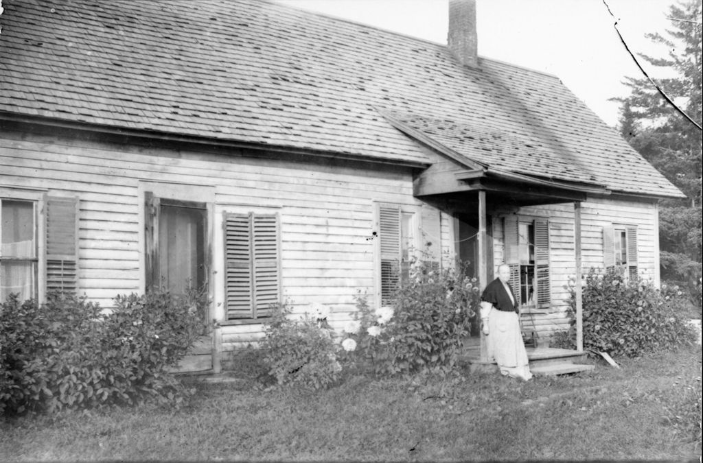 Miniature of Woman leaning against the front porch