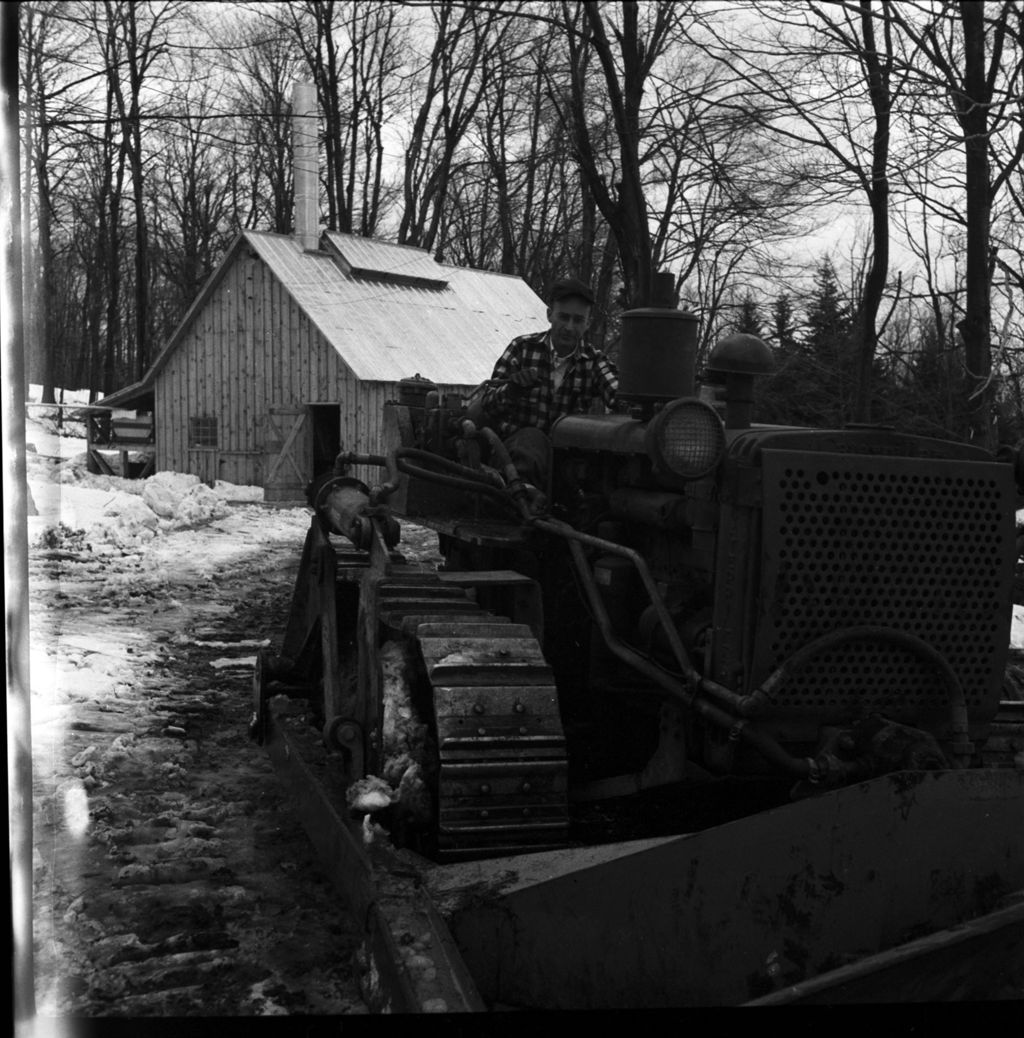 Miniature of Fred Taylor on tractor in front of sugar house