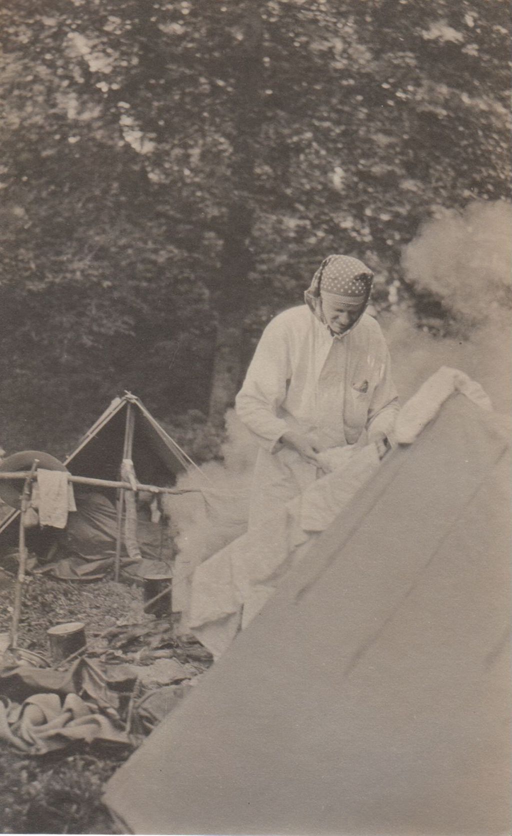 Miniature of Man at tent doing laundry