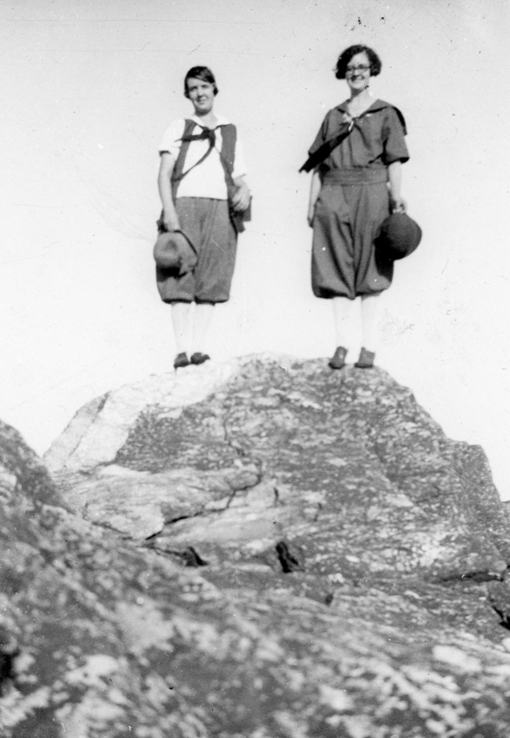 Miniature of Two women with hats atop a rock