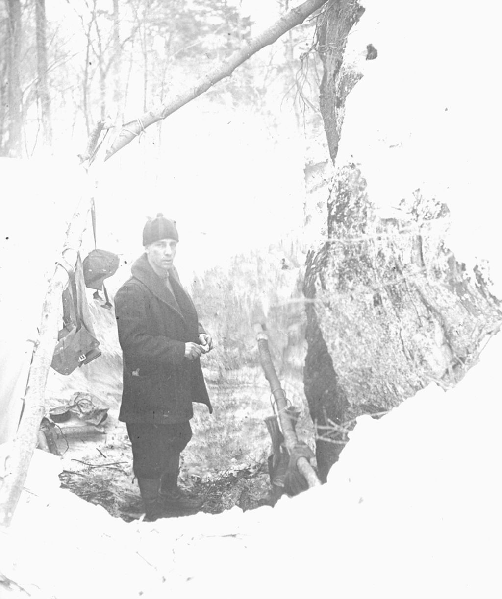 Miniature of L.L. Little in a camp pit on Smugglers' Notch