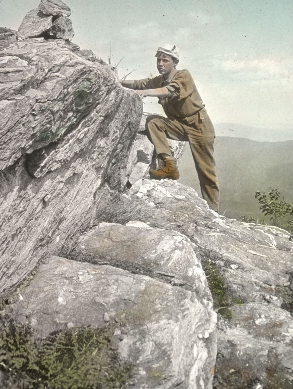 Miniature of Leverett Smith topping the first ledge of the New Trail on Couching Lion (Camel's Hump)