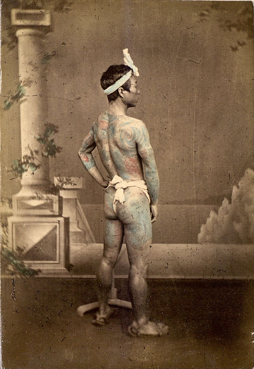 Miniature of Yakuza showing his tattoos