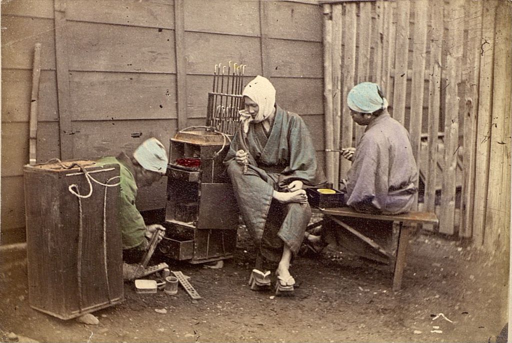 Miniature of Three street vendors taking a break