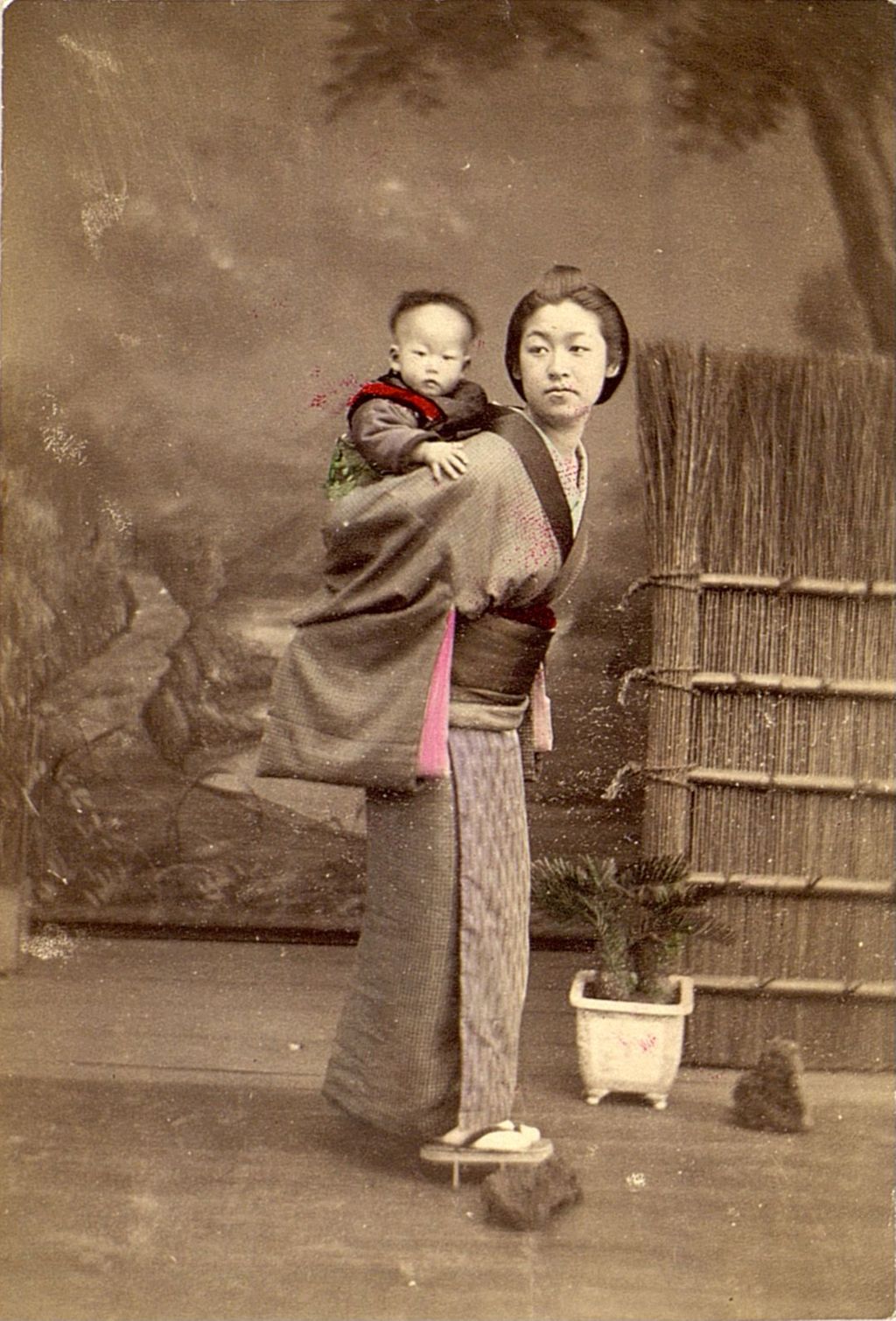 Miniature of Woman carrying her child on her back