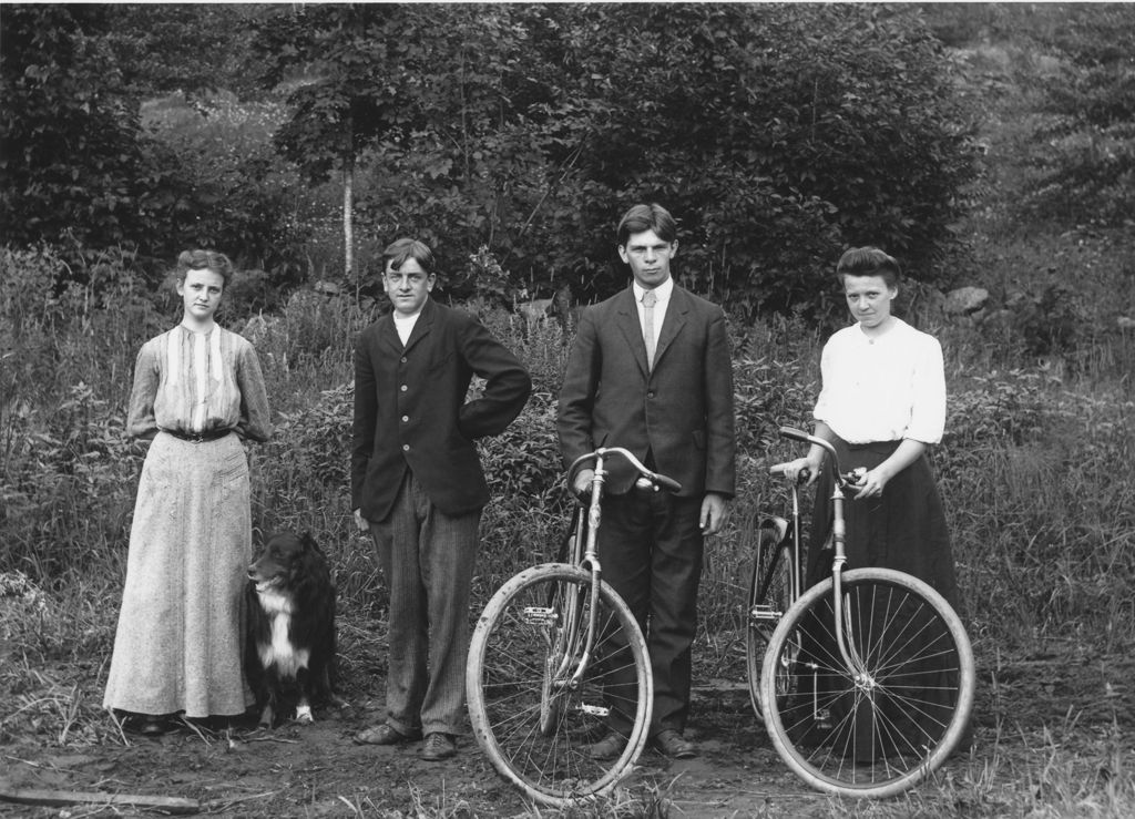 Miniature of Two couples with bicycles and a dog