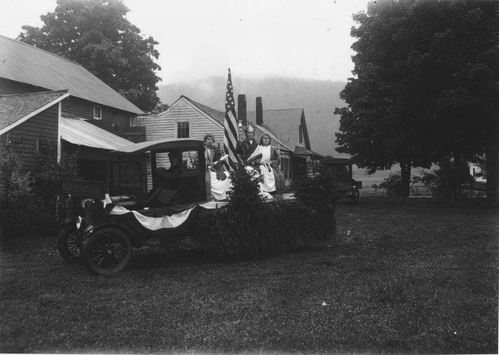 Miniature of Webster Thayer driving parade wagon with Doris Stone and Virginia Stratton