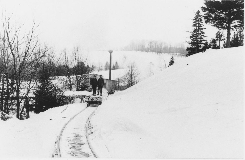 Miniature of Men standing on a small hand car transporting lumber in Wardsboro, Vt.